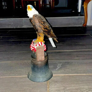 American patriotic bald eagle perched on liberty bell